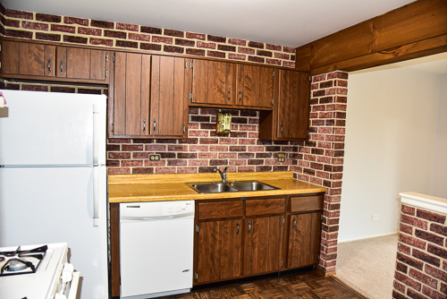 1560 7 Pines Road, Unit C1 Schaumburg, IL 60193 - Photo 2 of 17 a bathroom with a sink and a refrigerator