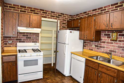 1560 7 Pines Road, Unit C1 Schaumburg, IL 60193 - Photo 7 of 17 a kitchen with a refrigerator a stove a sink and dishwasher