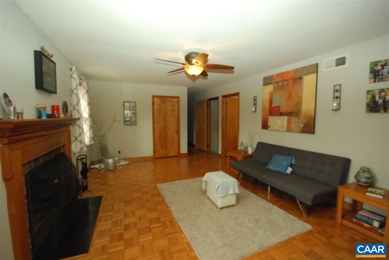 4826 Ivy Road Charlottesville, VA 22901 - Photo 4 of 35 a living room with furniture and a fireplace