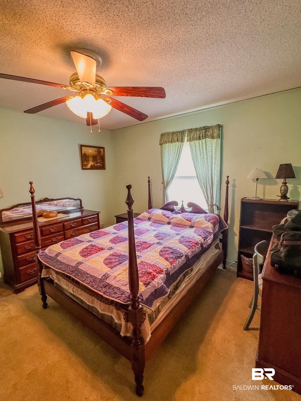1456 Allen Walker Road Grove Hill, AL 36451 - Photo 19 of 28 Bedroom featuring a textured ceiling, light carpet, and ceiling fan