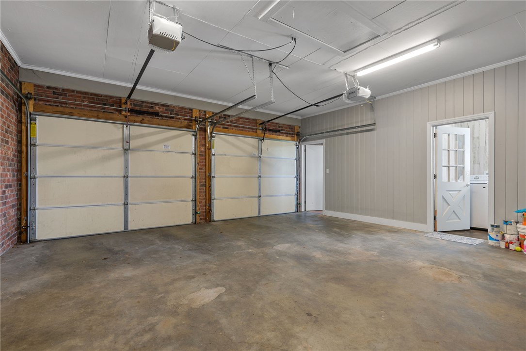 300 Green Street Williamston, SC 29697 - Photo 45 of 47 This spacious garage offers ample room for vehicles and storage, with convenient access to the interior.