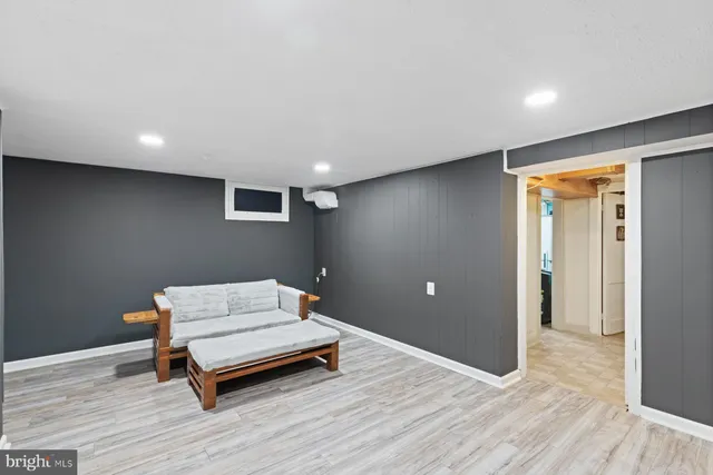 a room with a wooden floor and furniture