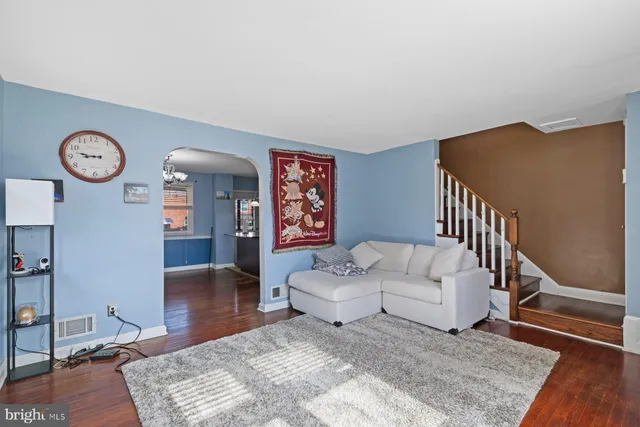 a living room with furniture and a table