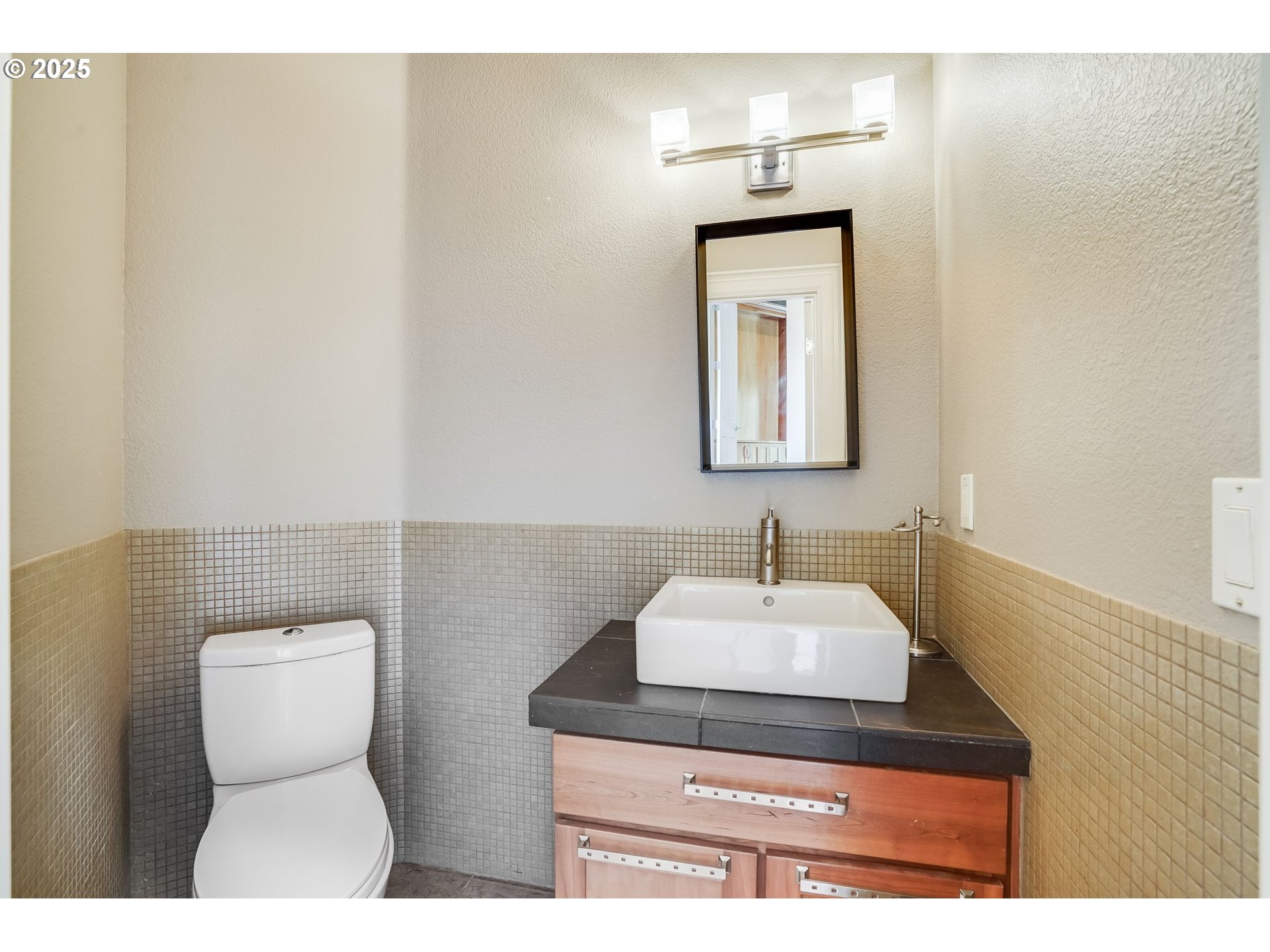 9309 Northwest Finzer Court Portland, OR 97229 - Photo 14 of 43 a bathroom with a toilet sink and mirror