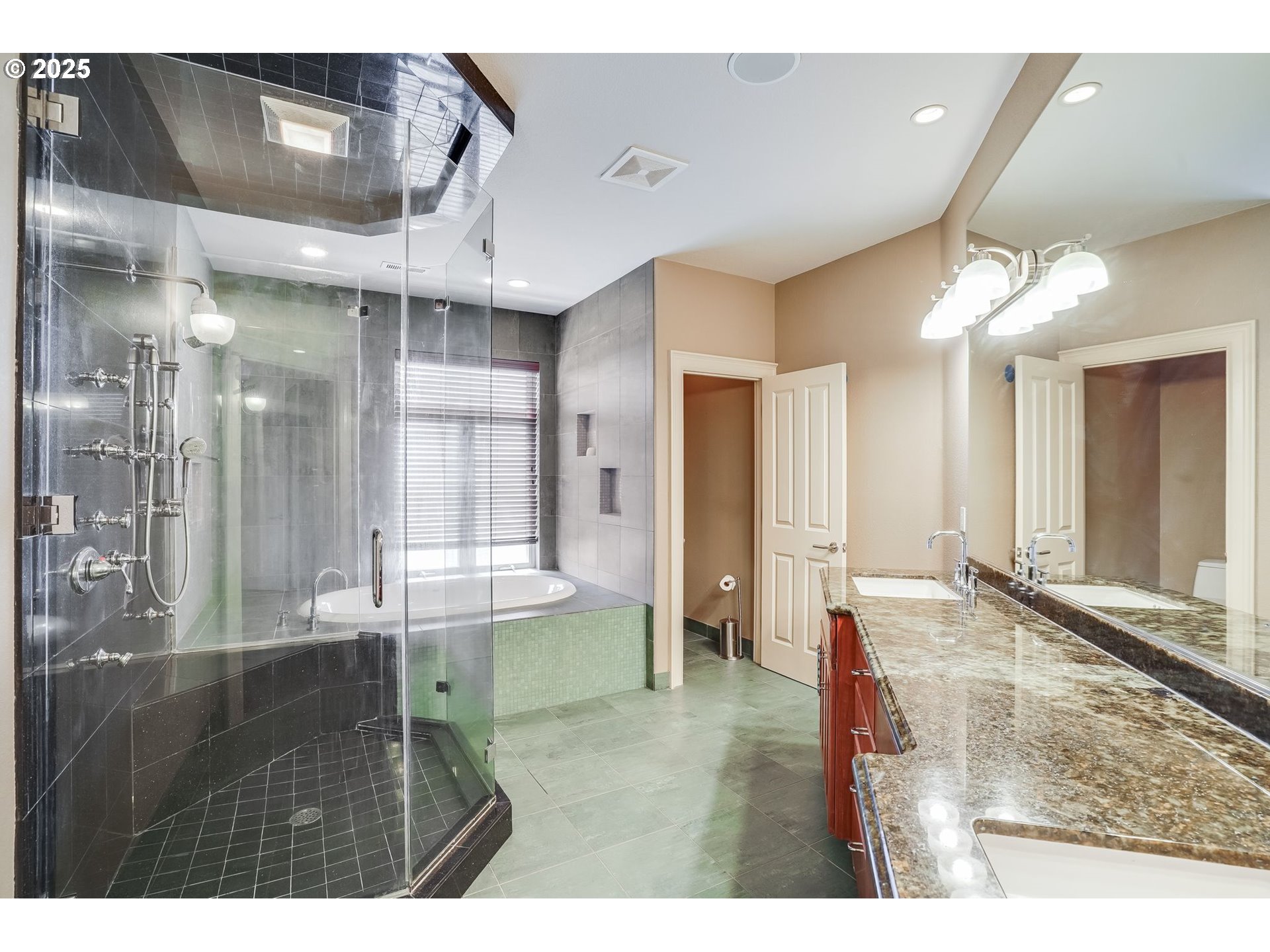 9309 Northwest Finzer Court Portland, OR 97229 - Photo 17 of 43 a bathroom with a tub shower and sink