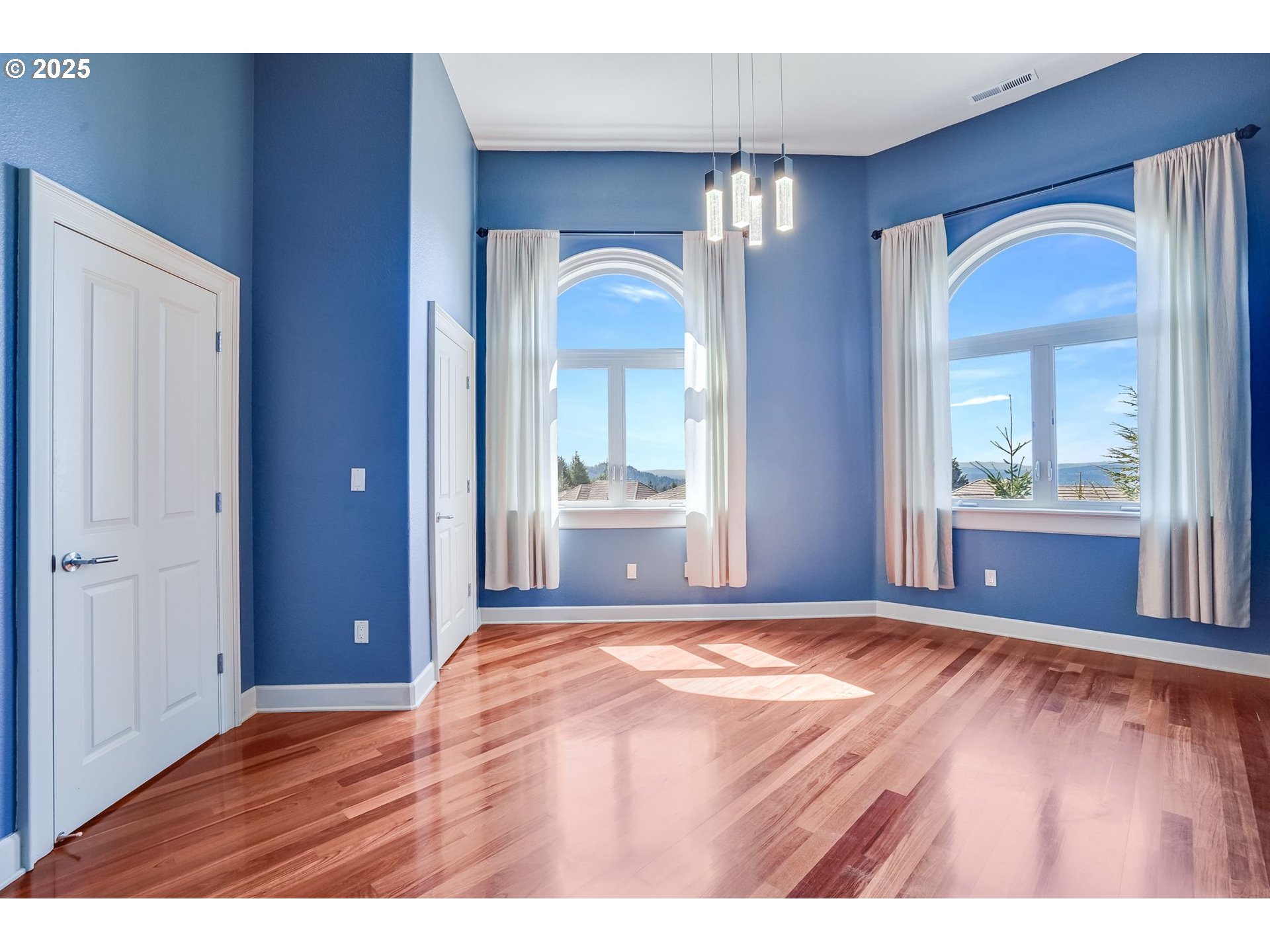 9309 Northwest Finzer Court Portland, OR 97229 - Photo 28 of 43 a bedroom with a bed and a view of living room