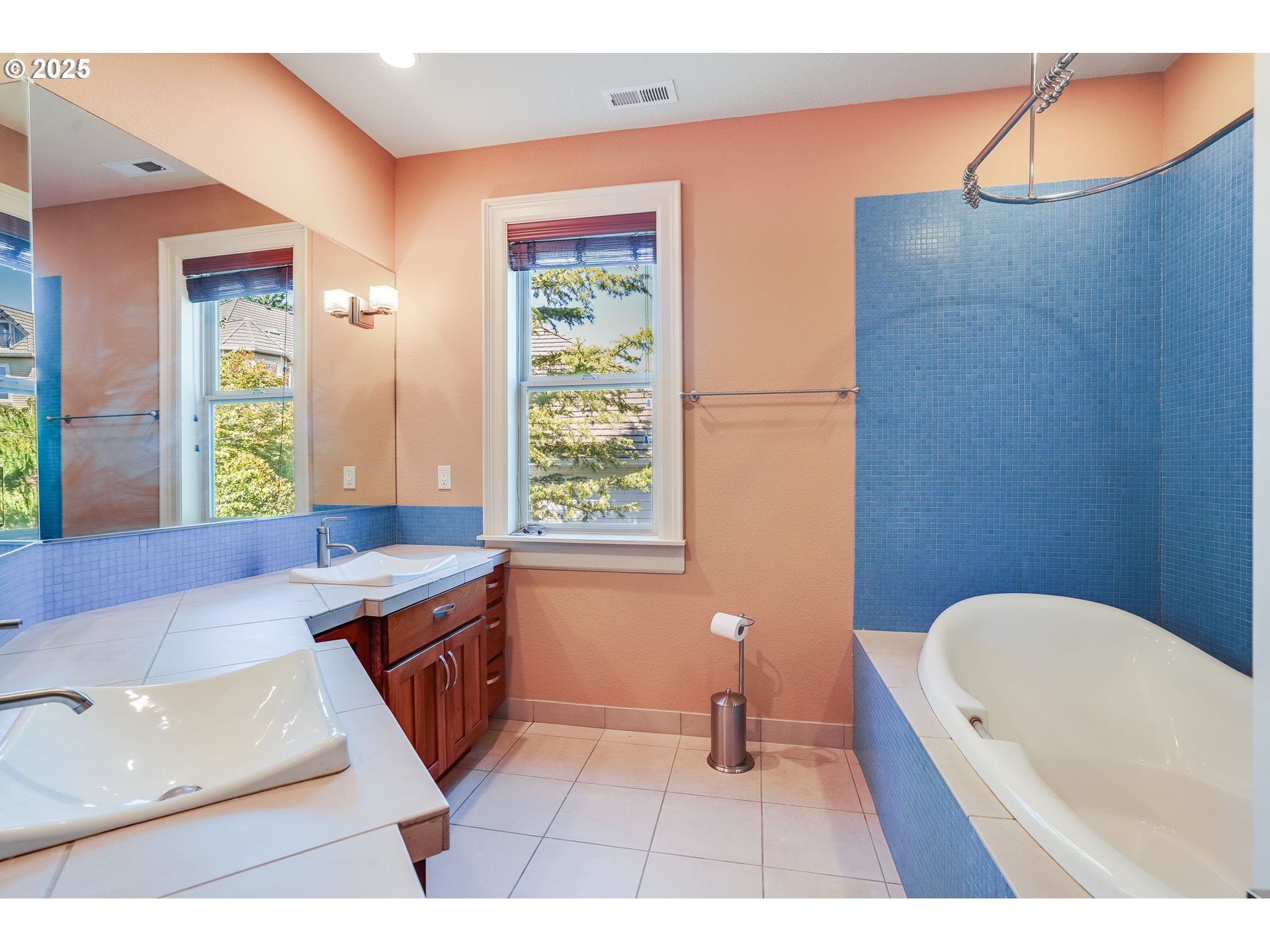 9309 Northwest Finzer Court Portland, OR 97229 - Photo 30 of 43 a bathroom with a tub sink and a window