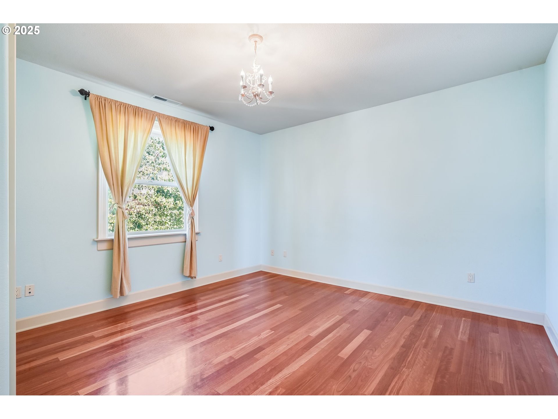 9309 Northwest Finzer Court Portland, OR 97229 - Photo 31 of 43 a view of an empty room with wooden floor and a window