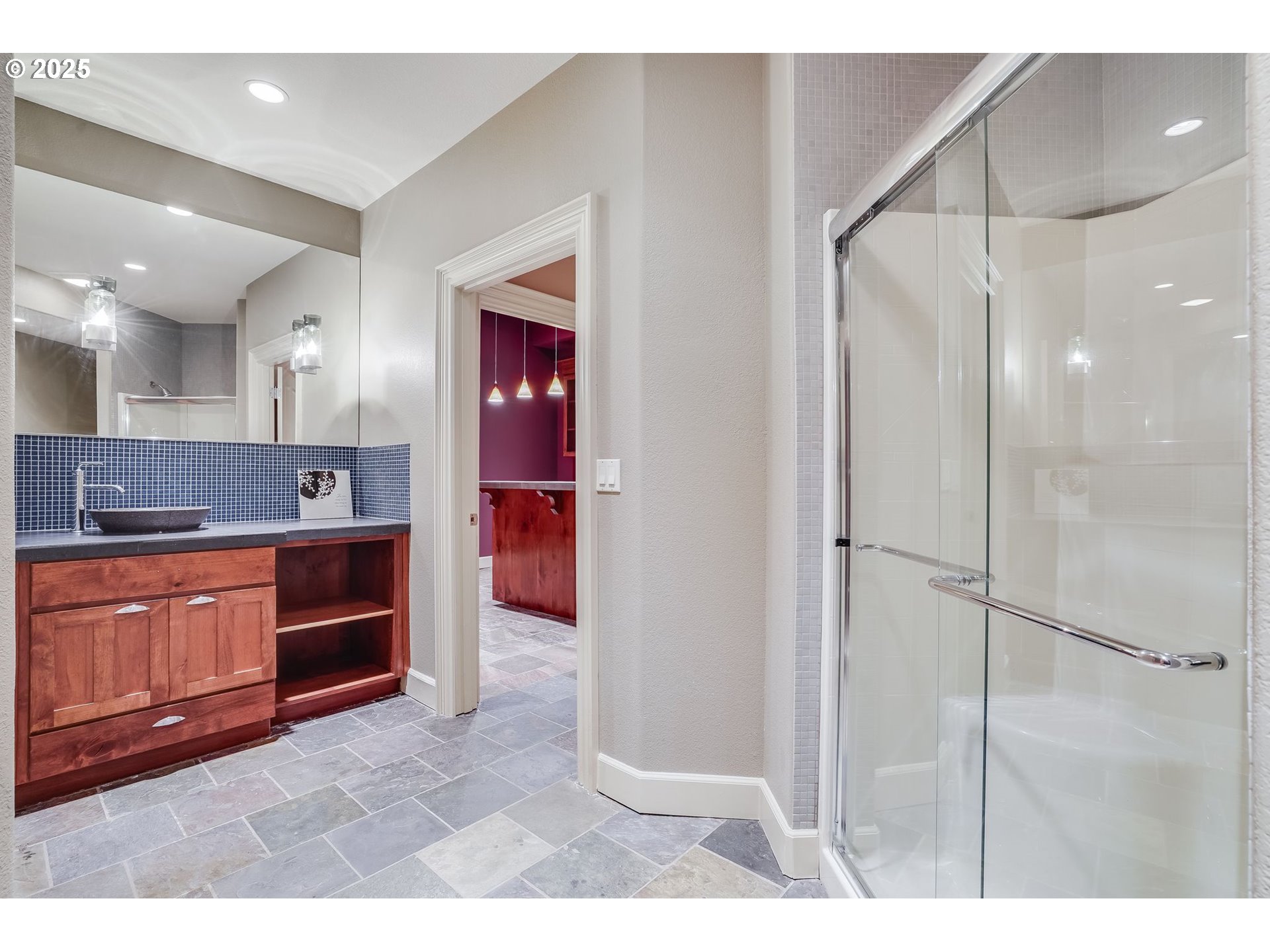 9309 Northwest Finzer Court Portland, OR 97229 - Photo 33 of 43 a large bathroom with a granite countertop sink mirror and cabinets