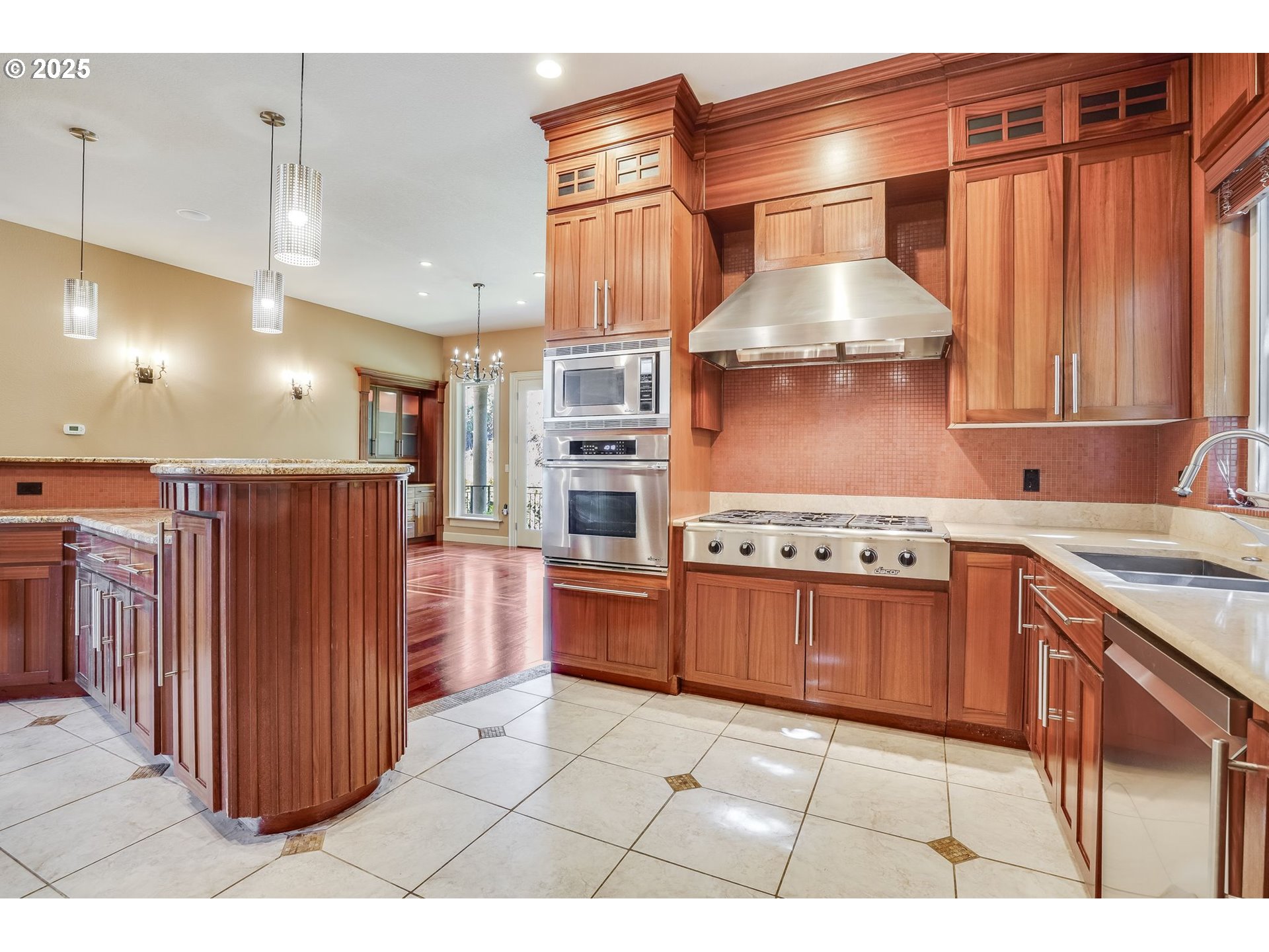 9309 Northwest Finzer Court Portland, OR 97229 - Photo 9 of 43 a kitchen with stainless steel appliances granite countertop a stove a sink dishwasher and a refrigerator