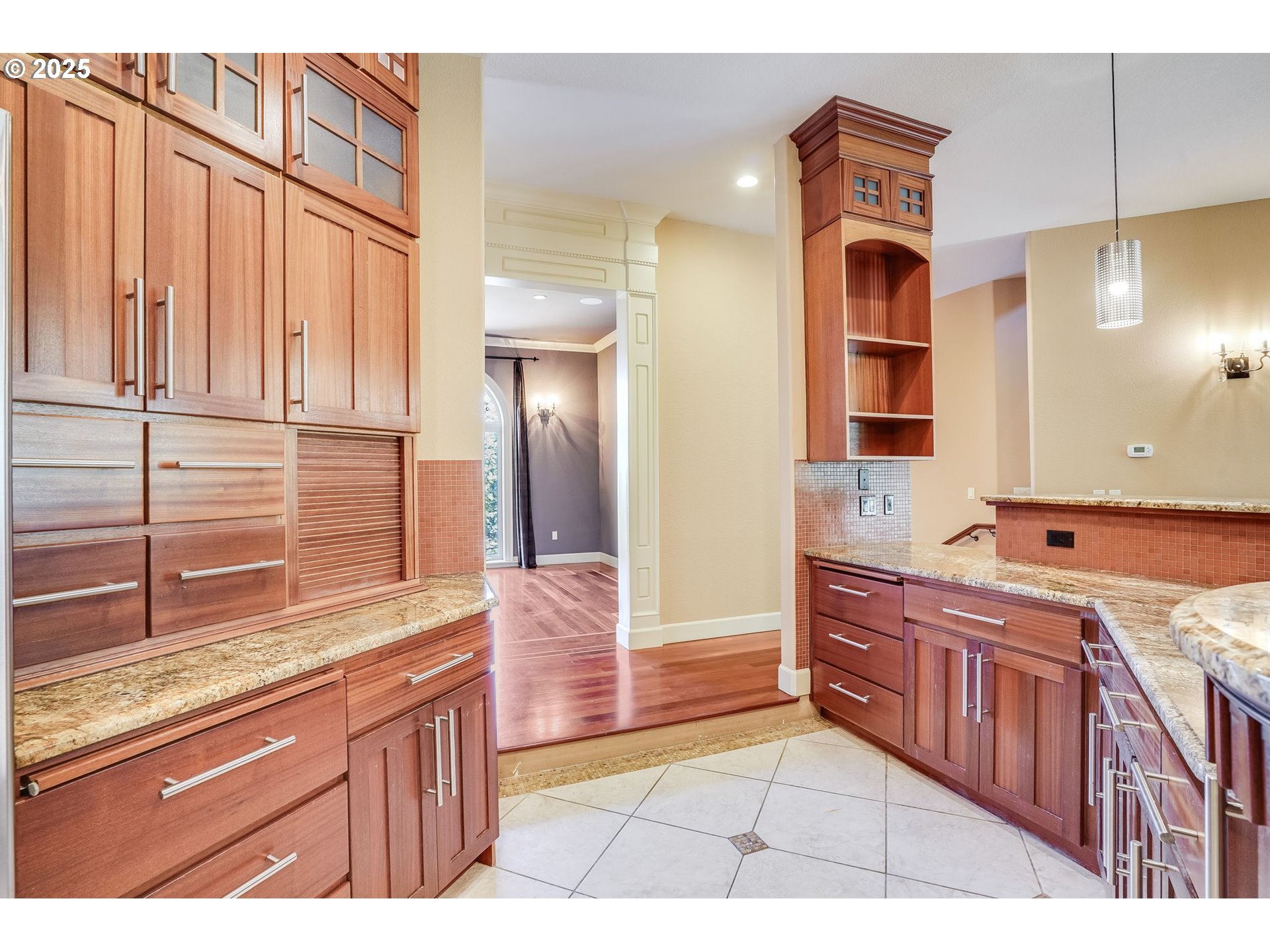 9309 Northwest Finzer Court Portland, OR 97229 - Photo 10 of 43 a kitchen with stainless steel appliances granite countertop a sink and a cabinets
