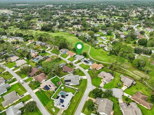 a hall way with furniture and a window