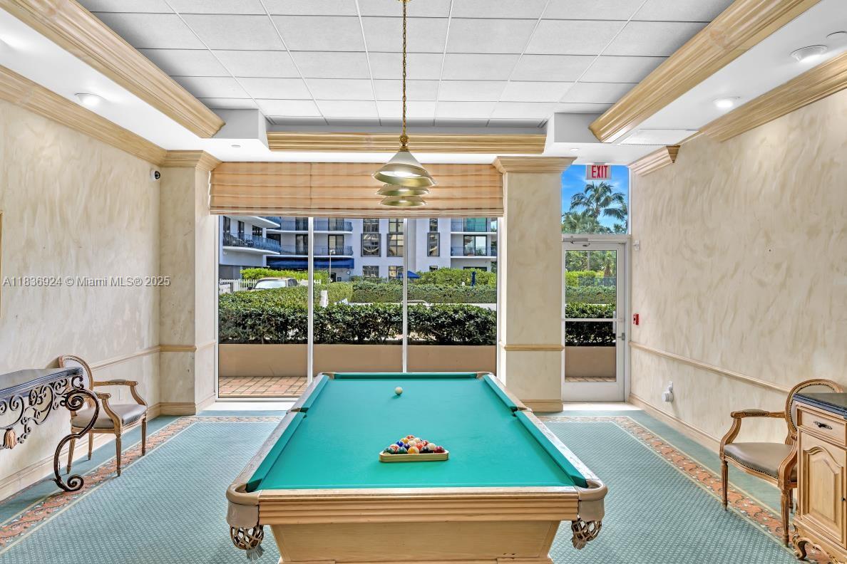 8855 Collins Avenue, Unit 2F Surfside, FL 33154 - Photo 13 of 79 a room with pool table and windows