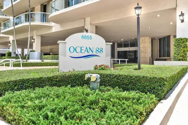 a kitchen with a sink cabinets and refrigerator