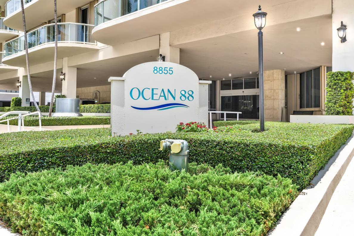 8855 Collins Avenue, Unit 2F Surfside, FL 33154 - Photo 20 of 79 a sign board with a play ground in the back