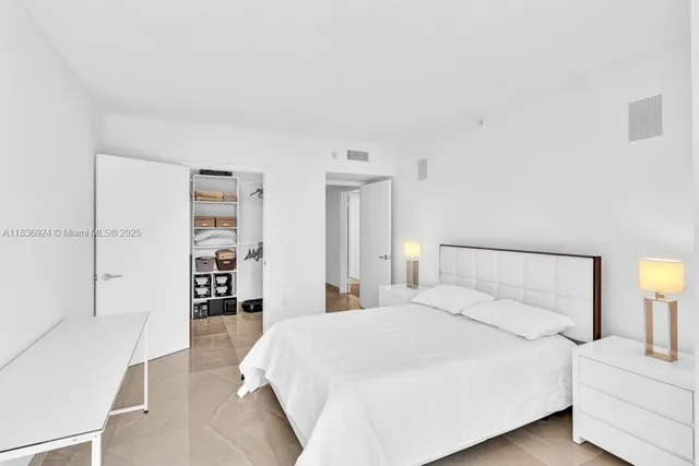 a dining area with furniture and a large window