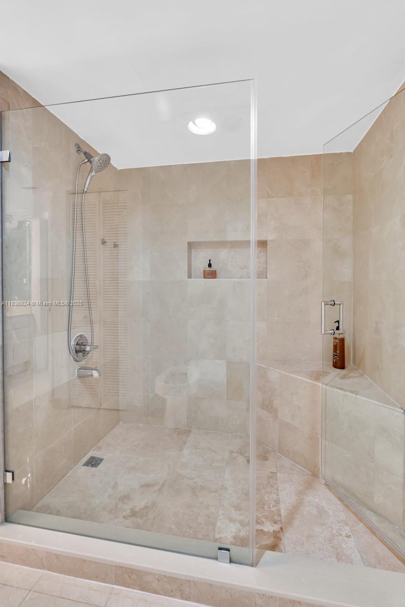 8855 Collins Avenue, Unit 2F Surfside, FL 33154 - Photo 26 of 79 a bathroom with a shower