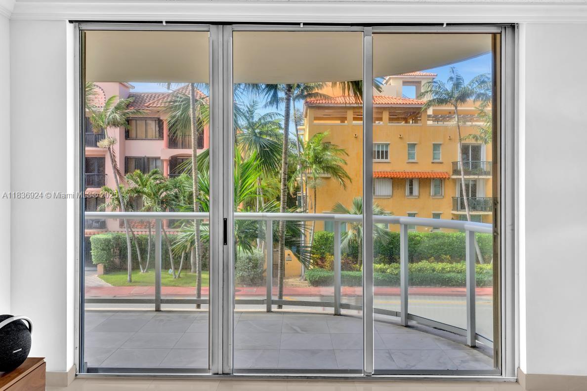8855 Collins Avenue, Unit 2F Surfside, FL 33154 - Photo 43 of 79 a view of a glass door with a glass door