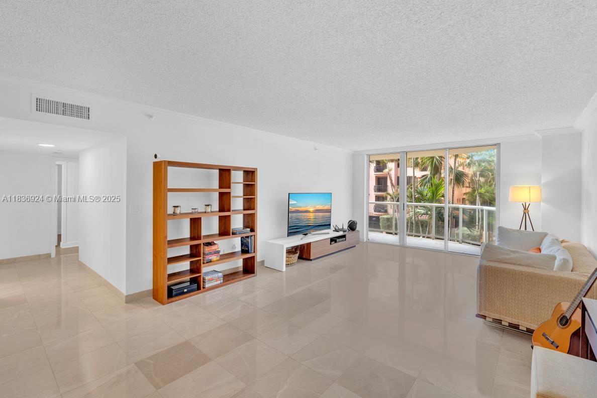8855 Collins Avenue, Unit 2F Surfside, FL 33154 - Photo 45 of 79 a view of a livingroom with furniture and a window