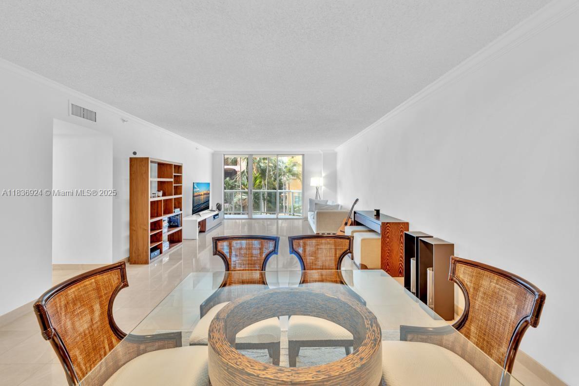 8855 Collins Avenue, Unit 2F Surfside, FL 33154 - Photo 50 of 79 a living room with furniture and a wooden floor