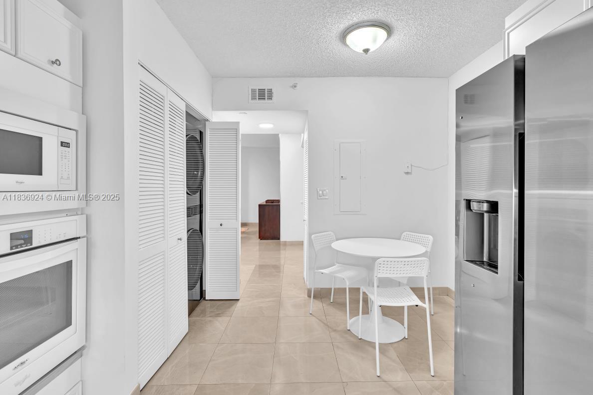 8855 Collins Avenue, Unit 2F Surfside, FL 33154 - Photo 59 of 79 a bathroom with a toilet sink and a mirror
