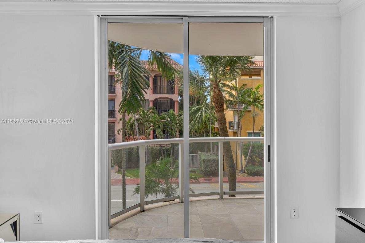 8855 Collins Avenue, Unit 2F Surfside, FL 33154 - Photo 64 of 79 a view of a glass door with a glass door