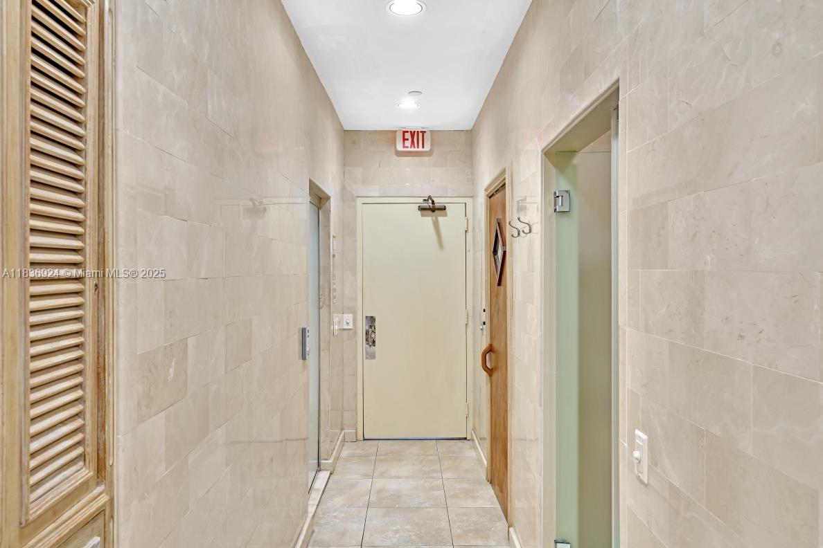8855 Collins Avenue, Unit 2F Surfside, FL 33154 - Photo 69 of 79 a en suite bathroom with a shower