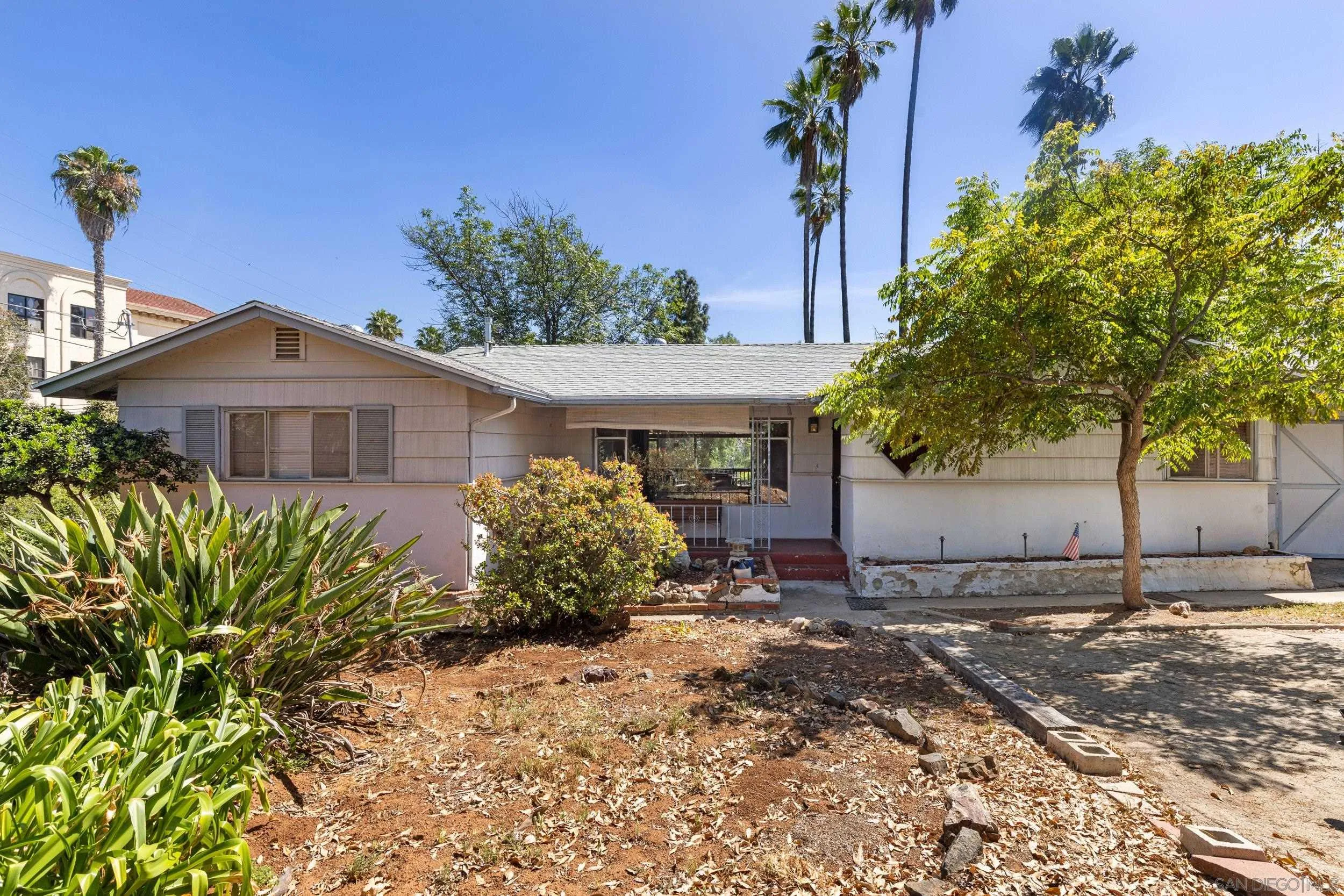 9361 Hollyhock Lane Spring Valley, CA 91977 - Photo 2 of 31 a front view of a house with garden