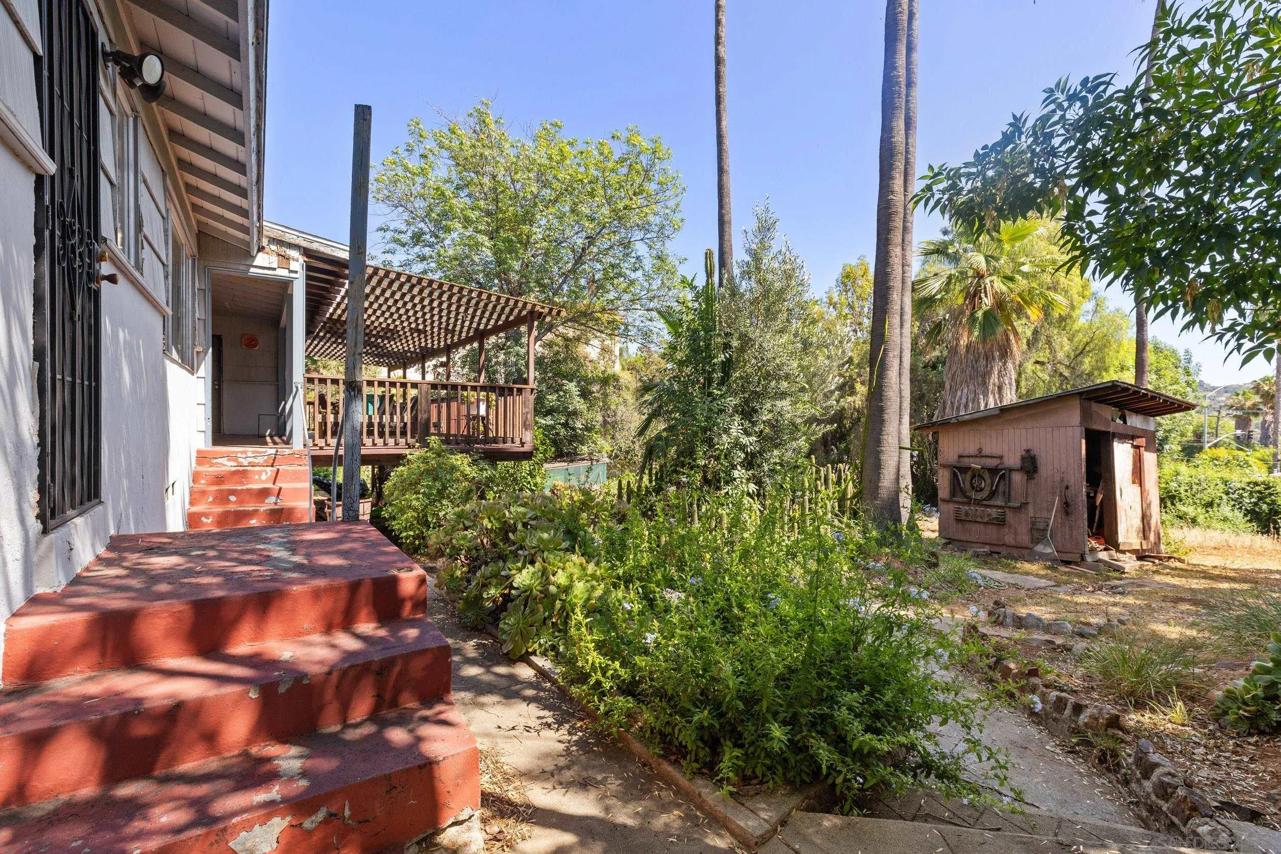 9361 Hollyhock Lane Spring Valley, CA 91977 - Photo 21 of 31 a view of a house with a yard