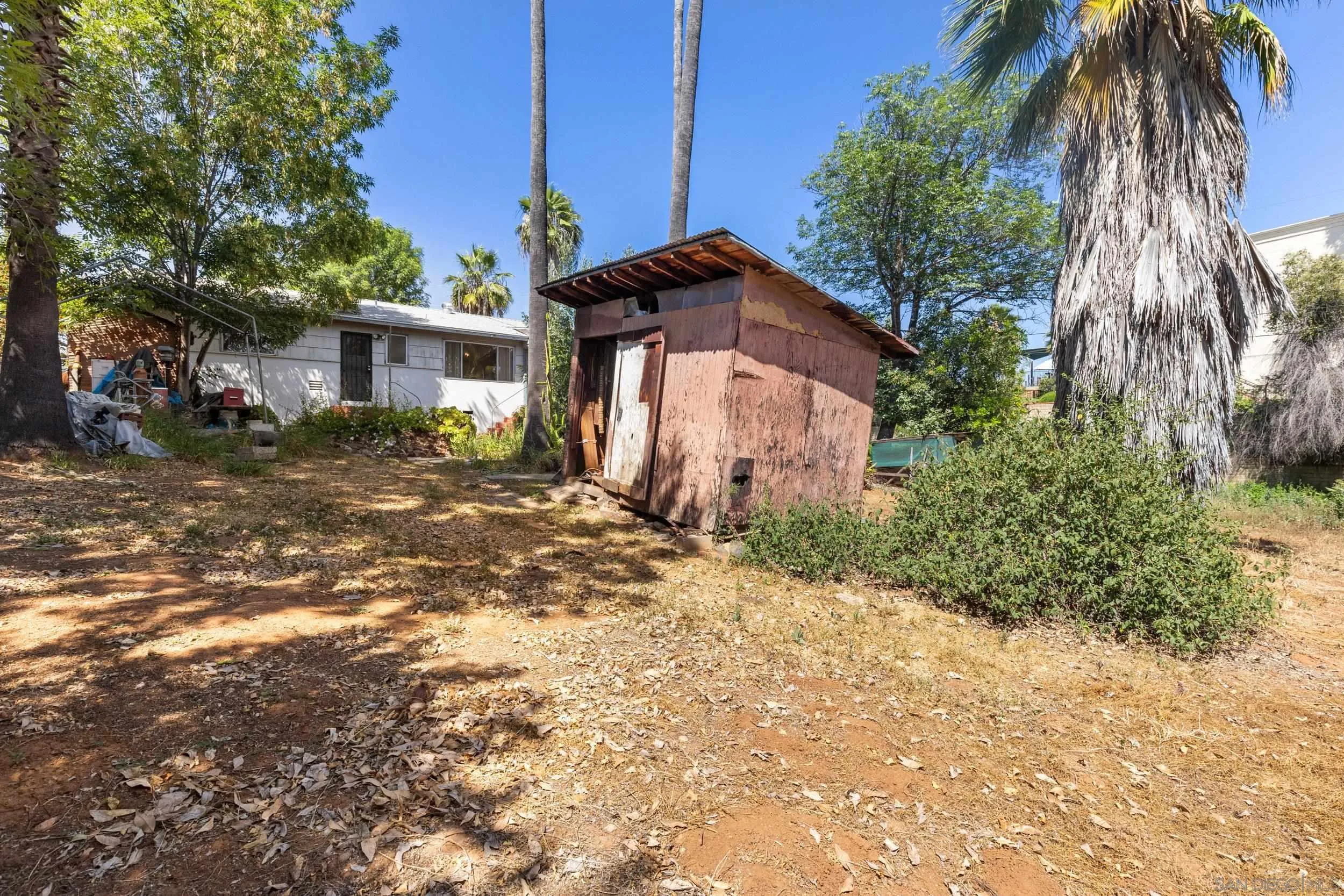 9361 Hollyhock Lane Spring Valley, CA 91977 - Photo 22 of 31 a front view of a house with a yard