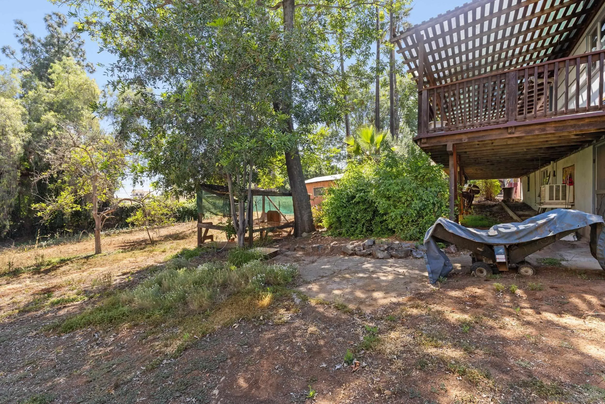 9361 Hollyhock Lane Spring Valley, CA 91977 - Photo 28 of 31 a view of a backyard with sitting area and tree