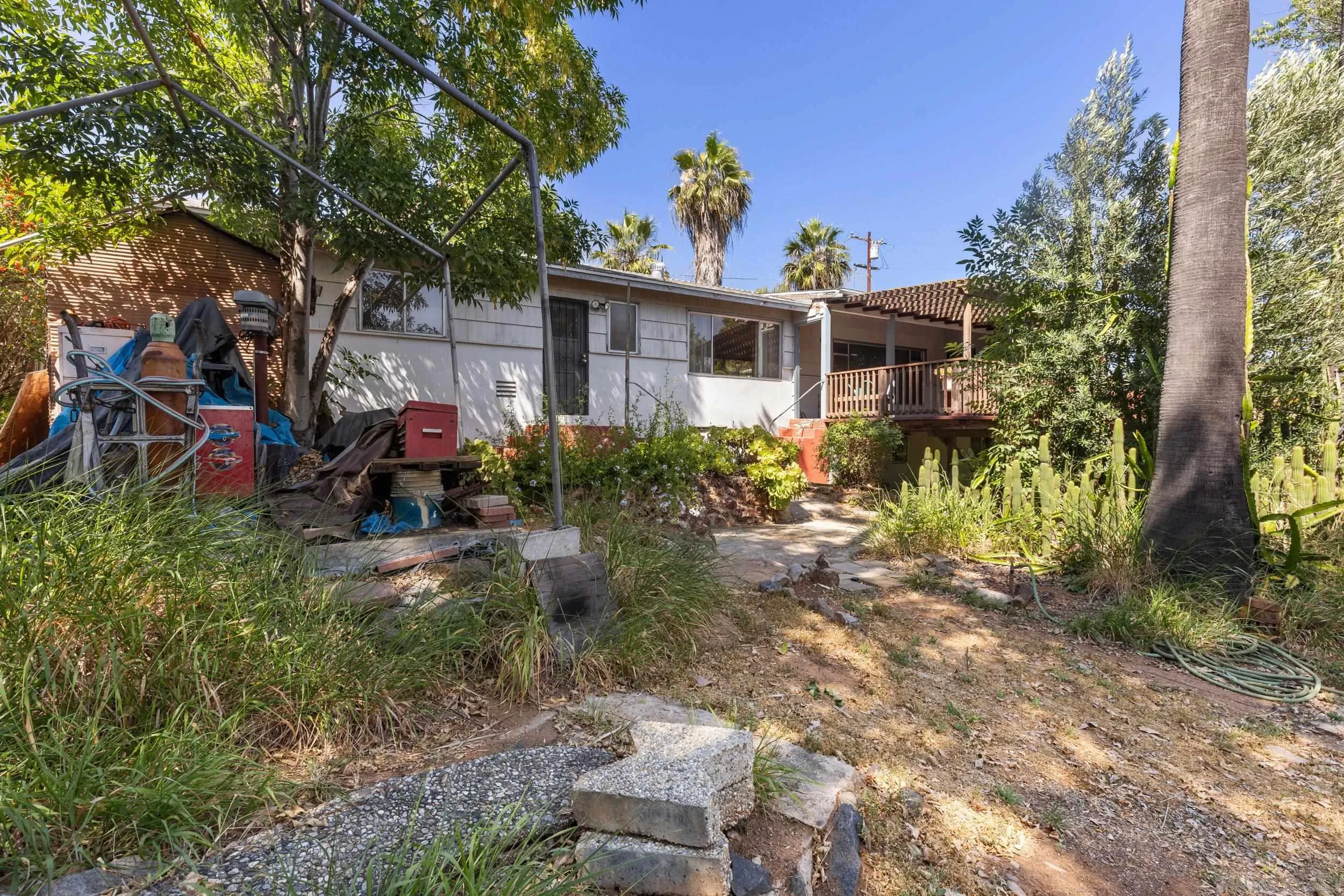 9361 Hollyhock Lane Spring Valley, CA 91977 - Photo 31 of 31 a front view of a house with yard and green space