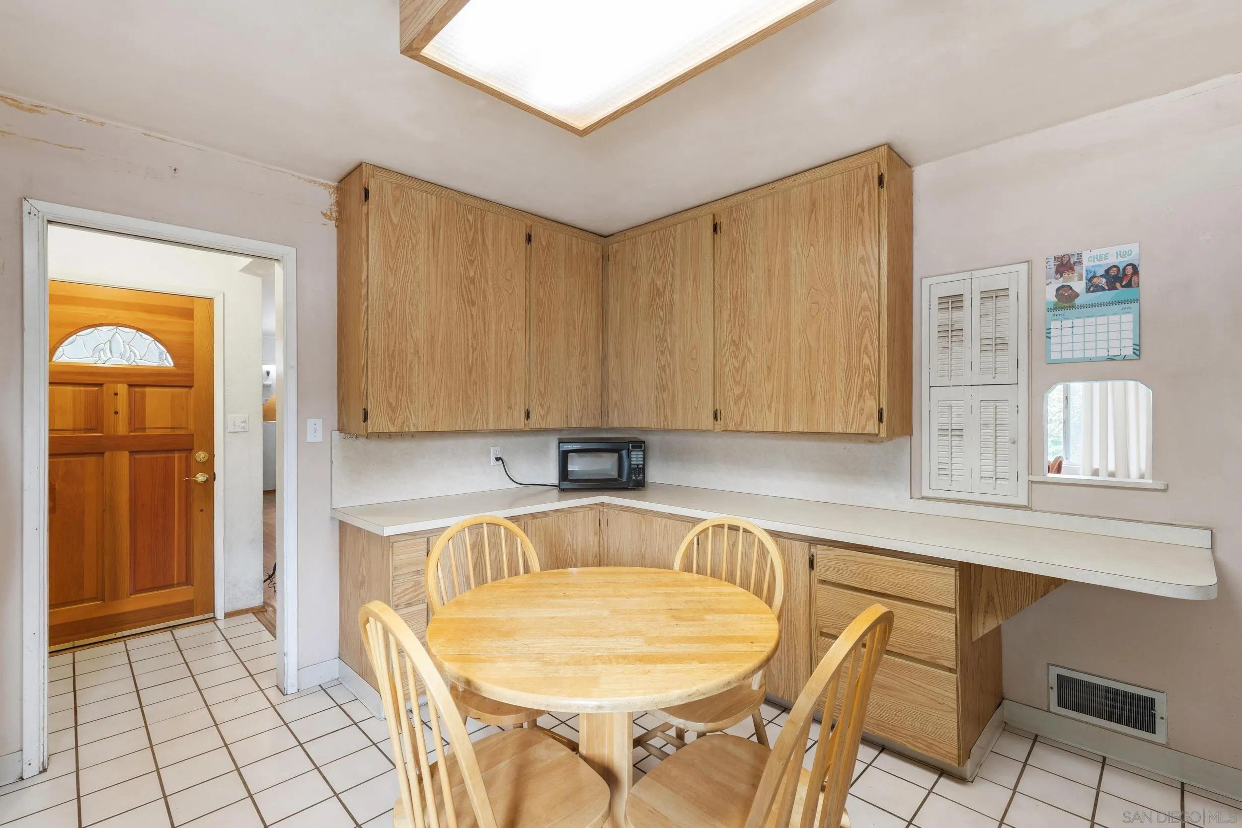 9361 Hollyhock Lane Spring Valley, CA 91977 - Photo 8 of 31 a room with a table chairs and chandelier