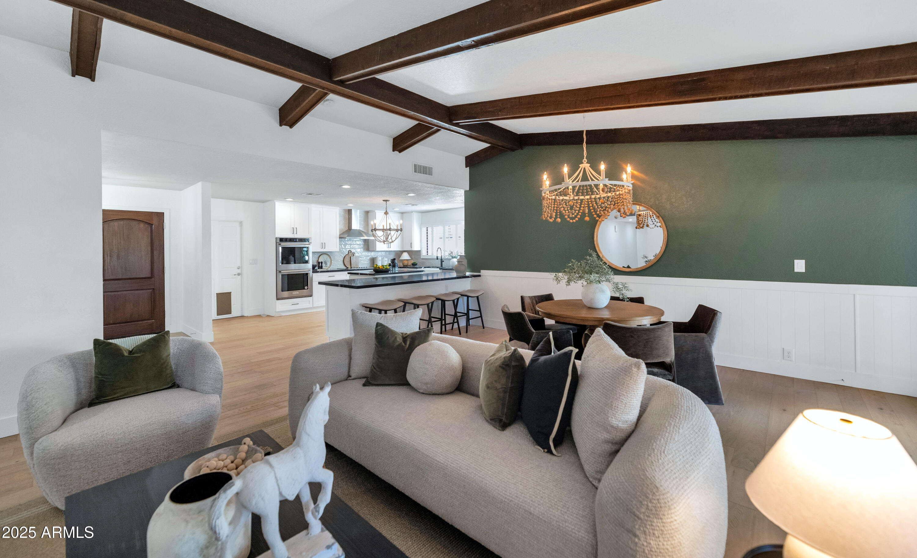4642 North 31st Street Phoenix, AZ 85016 - Photo 13 of 50 a living room with furniture and a wooden floor