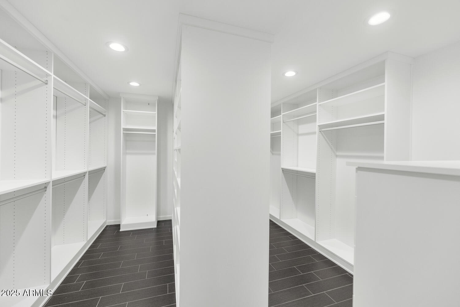 4642 North 31st Street Phoenix, AZ 85016 - Photo 17 of 50 a view of walk in closet with wooden floor