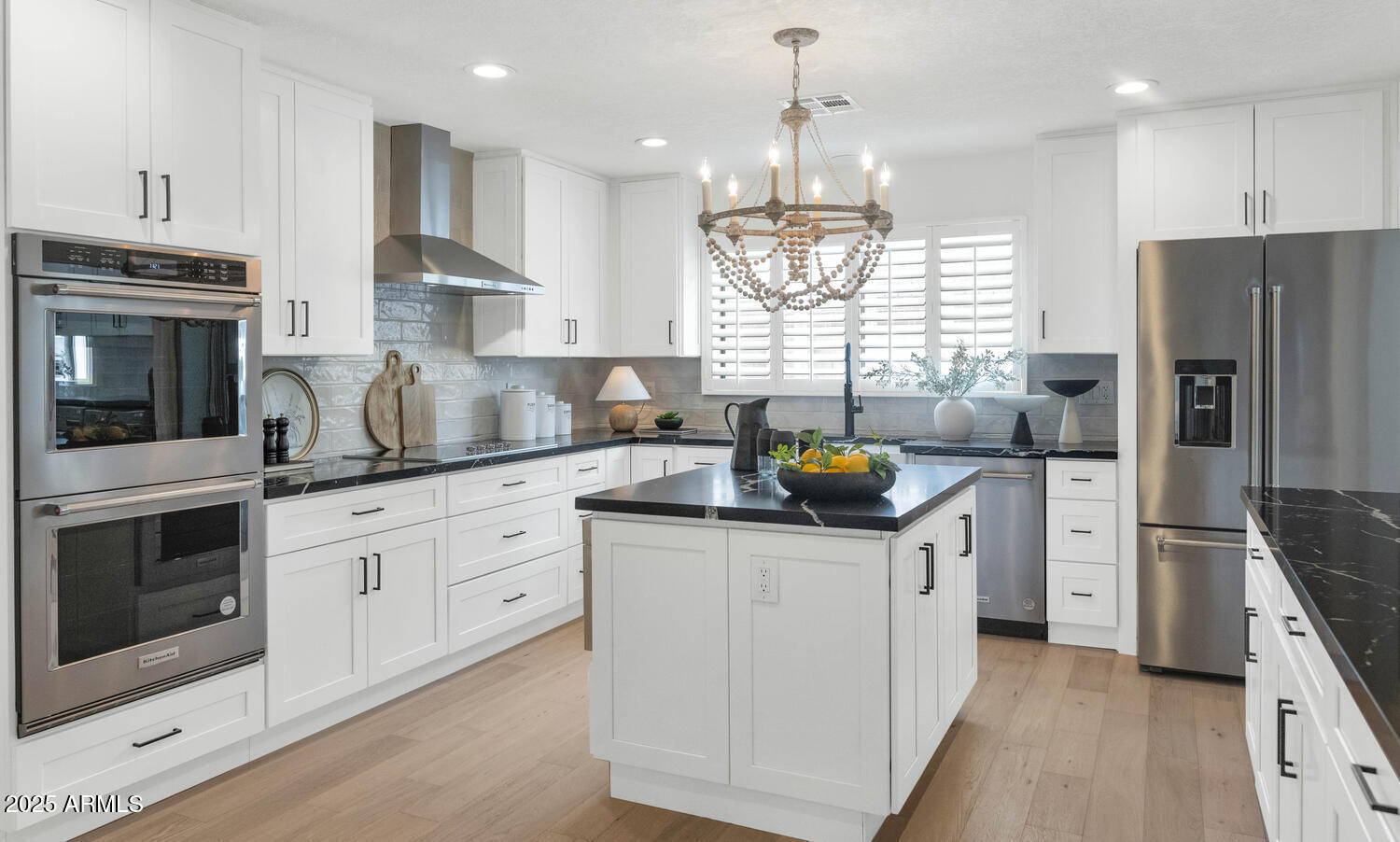 4642 North 31st Street Phoenix, AZ 85016 - Photo 19 of 50 a kitchen with stainless steel appliances kitchen island granite countertop a sink stove and refrigerator