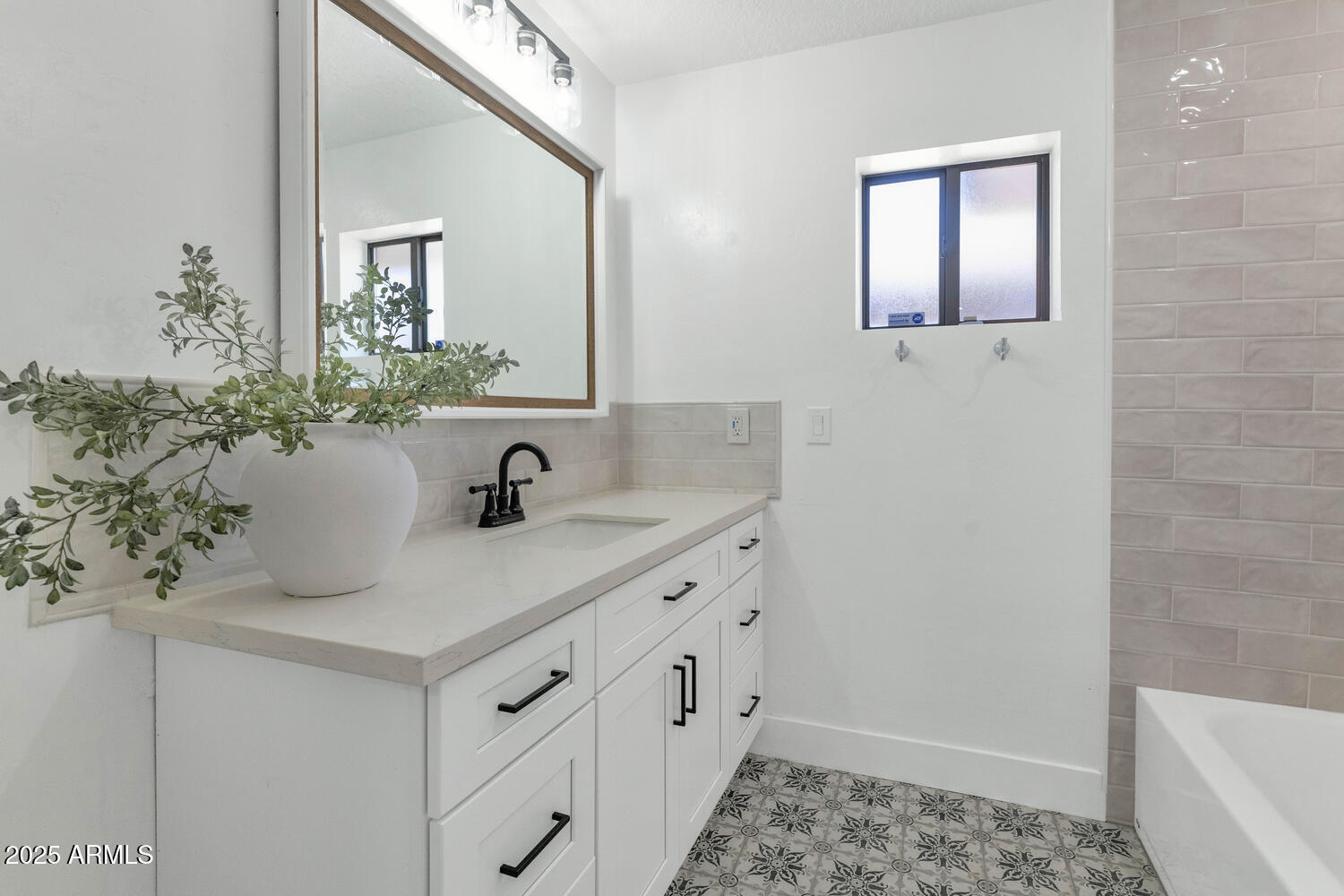4642 North 31st Street Phoenix, AZ 85016 - Photo 22 of 50 a bathroom with a sink and a mirror
