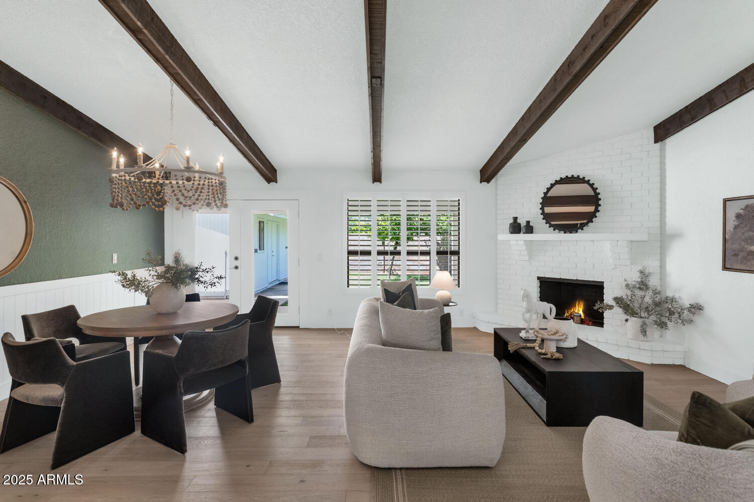 4642 North 31st Street Phoenix, AZ 85016 - Photo 23 of 50 a living room with furniture a fireplace and a dining table