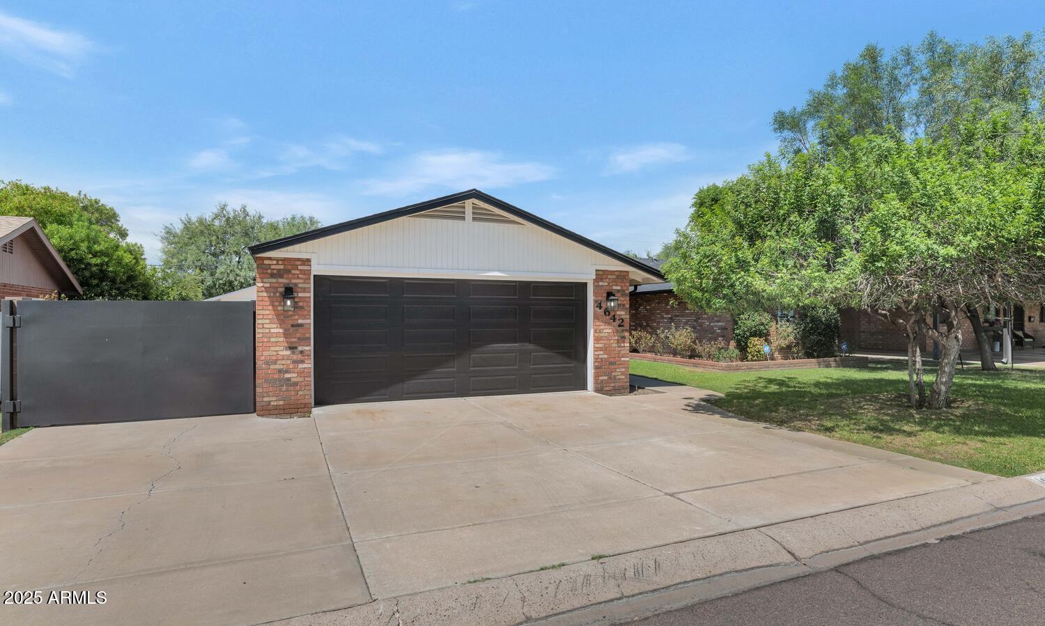 4642 North 31st Street Phoenix, AZ 85016 - Photo 8 of 50 front view of a house with yard and trees