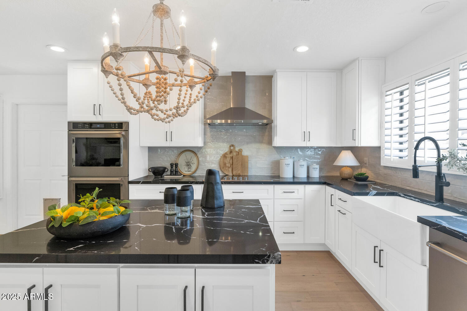 4642 North 31st Street Phoenix, AZ 85016 - Photo 9 of 50 a kitchen with stainless steel appliances granite countertop a sink a stove and a white cabinets