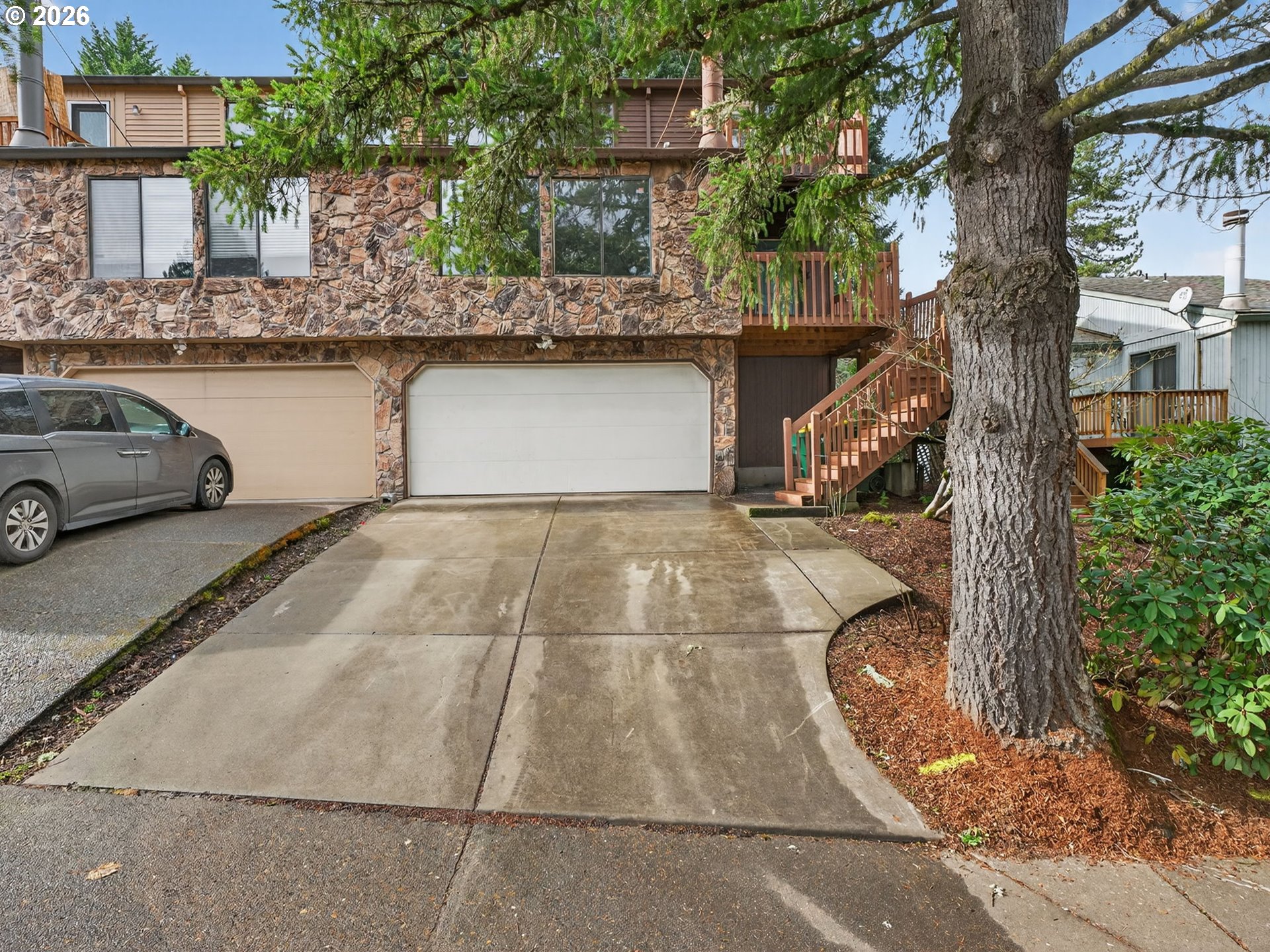 6805 Southwest 180th Avenue Beaverton, OR 97007 - Photo 1 of 29 a view of a car park in front of house