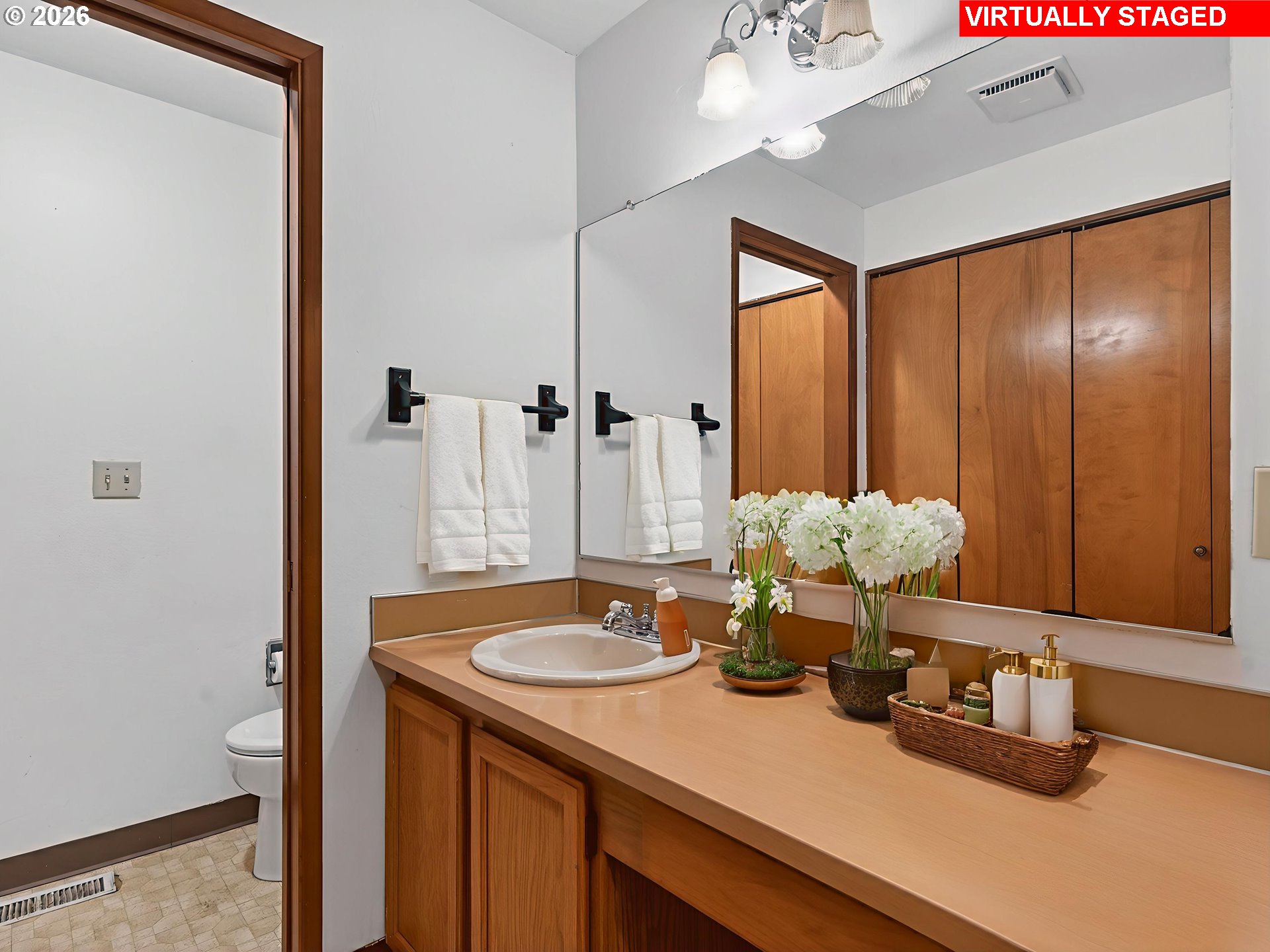 6805 Southwest 180th Avenue Beaverton, OR 97007 - Photo 11 of 29 a bathroom with a sink double vanity and a mirror
