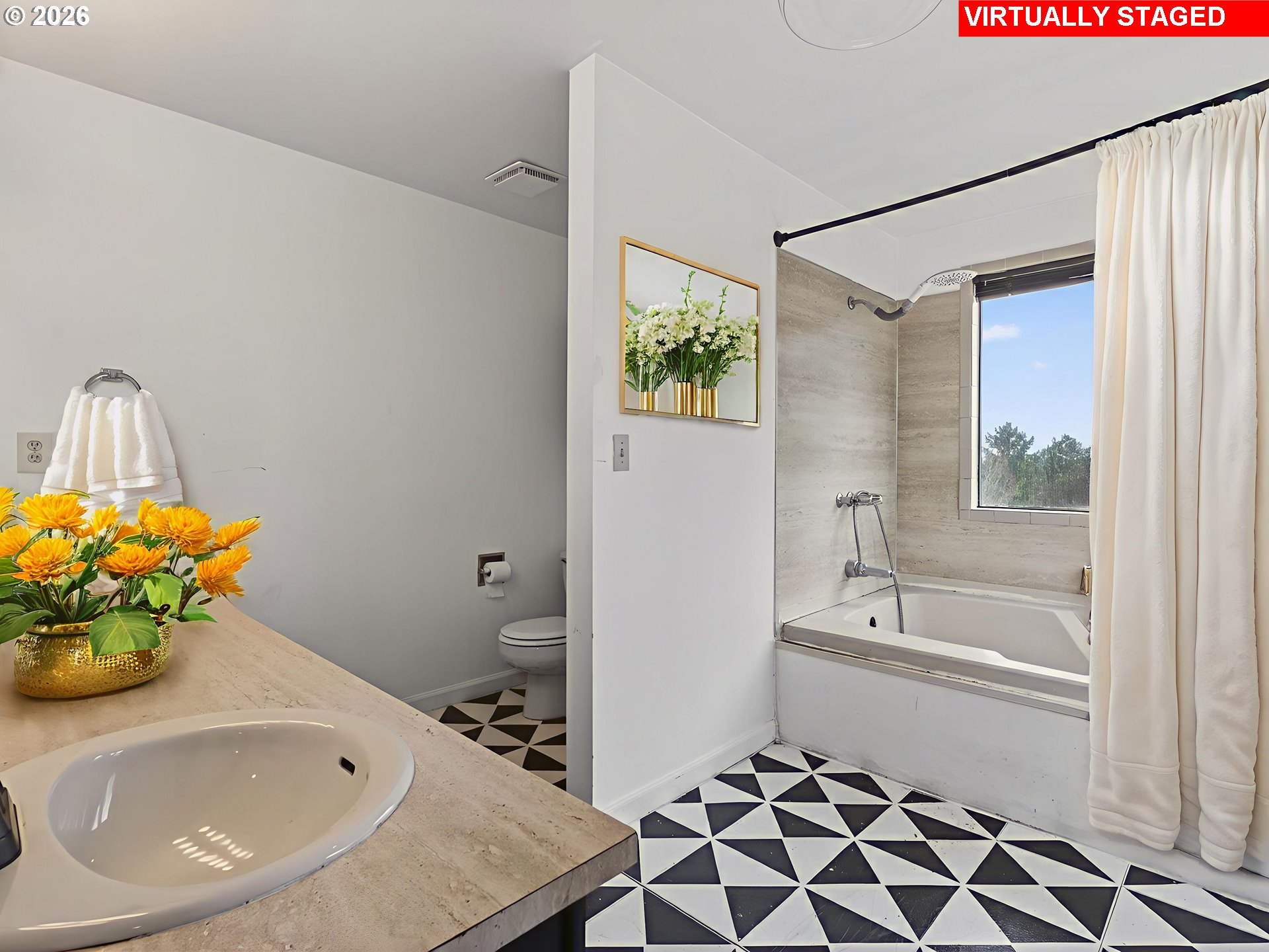 6805 Southwest 180th Avenue Beaverton, OR 97007 - Photo 14 of 29 a bathroom with a sink a toilet and a bathtub