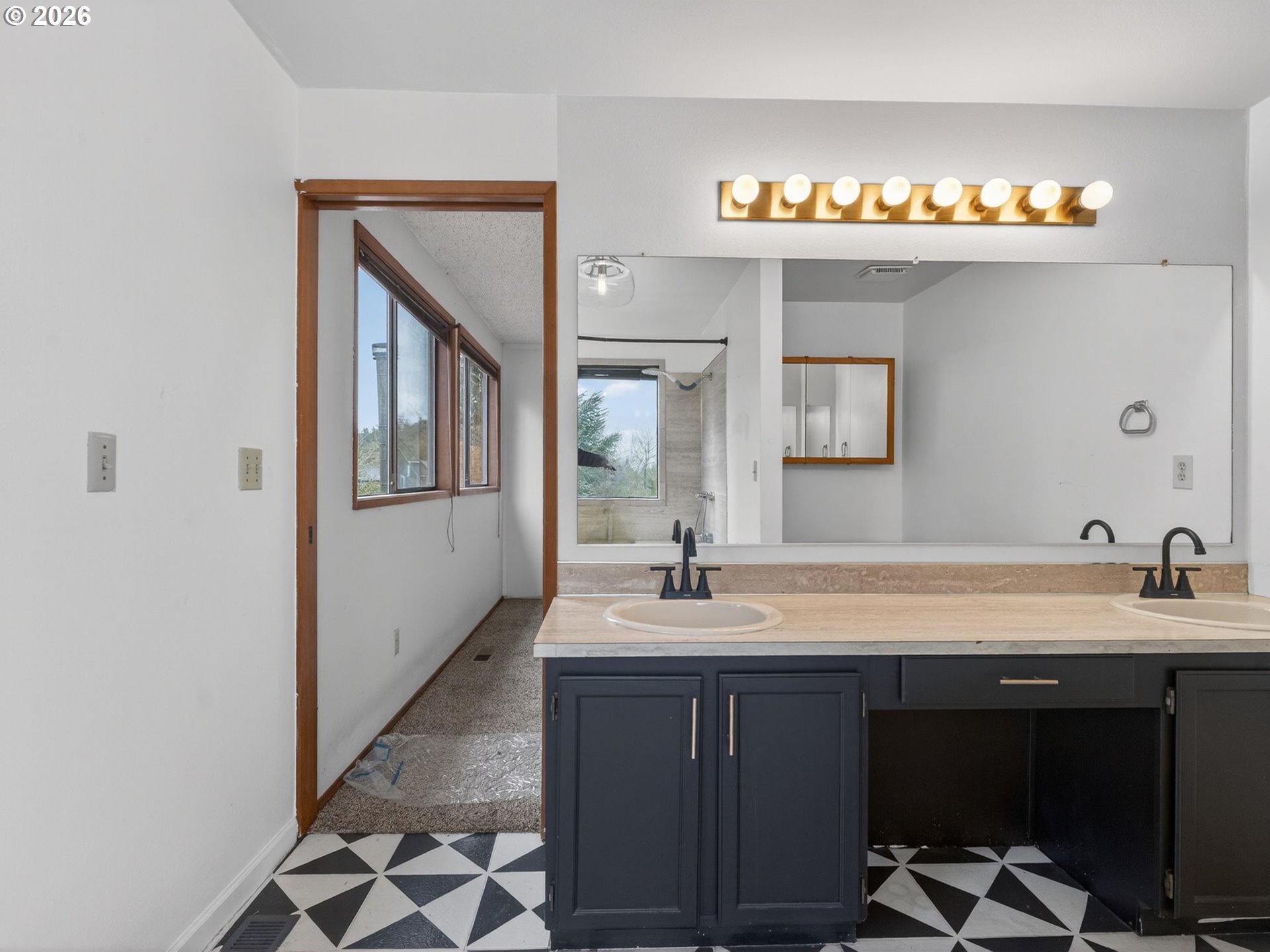 6805 Southwest 180th Avenue Beaverton, OR 97007 - Photo 15 of 29 a bathroom with a double vanity sink and a mirror