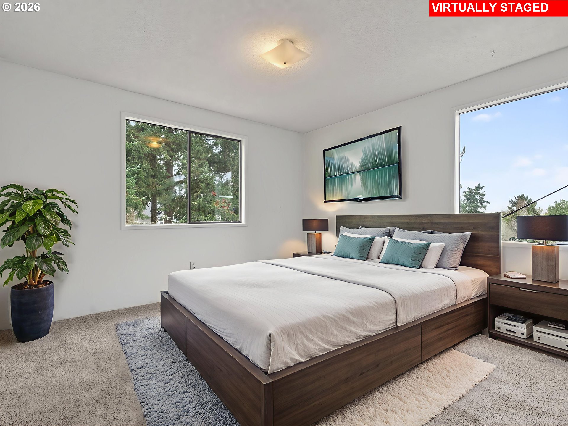 6805 Southwest 180th Avenue Beaverton, OR 97007 - Photo 17 of 29 a bedroom with a bed a potted plant and window