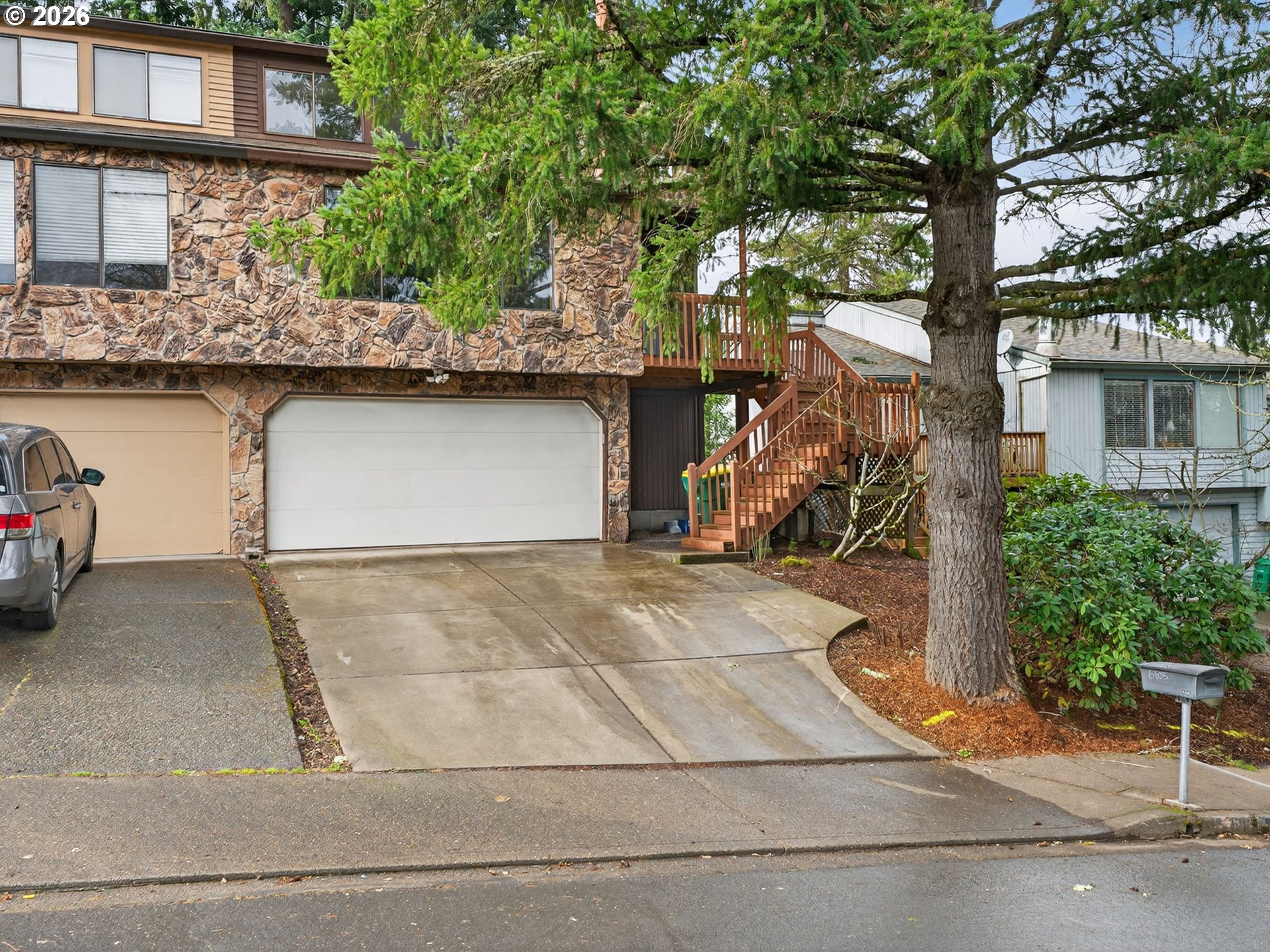 6805 Southwest 180th Avenue Beaverton, OR 97007 - Photo 4 of 29 a front view of a house with garage