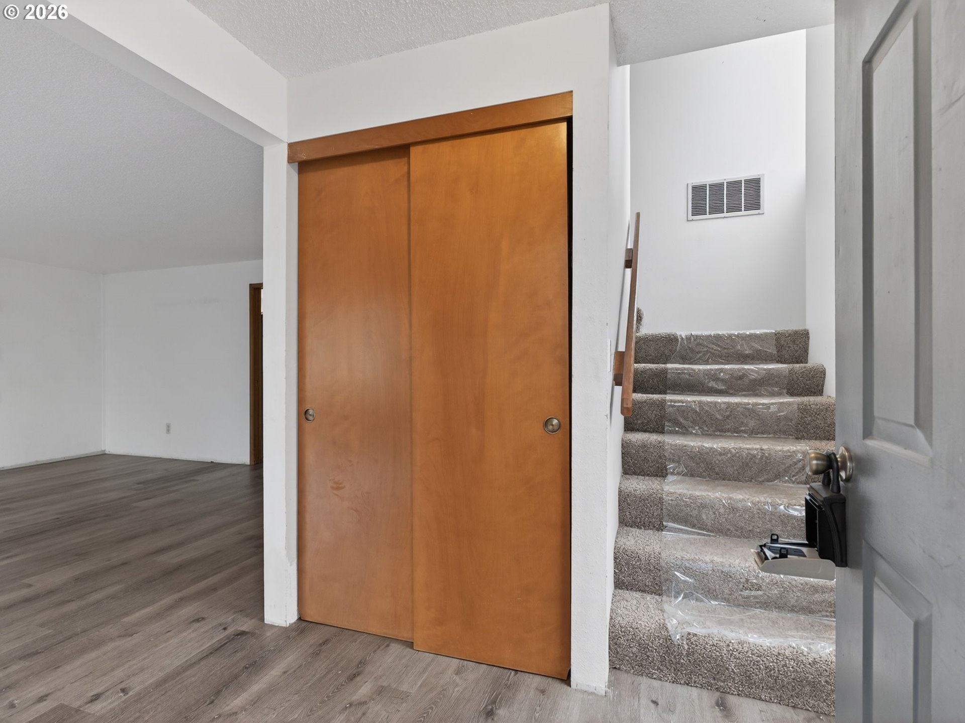 6805 Southwest 180th Avenue Beaverton, OR 97007 - Photo 5 of 29 a view of front door with wooden floor