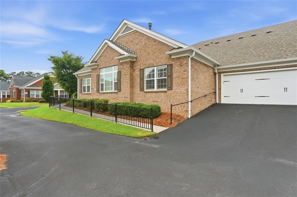 3328 Ivy Ridge Court Buford, GA 30519 - Photo 3 of 34 a view of a house next to a yard