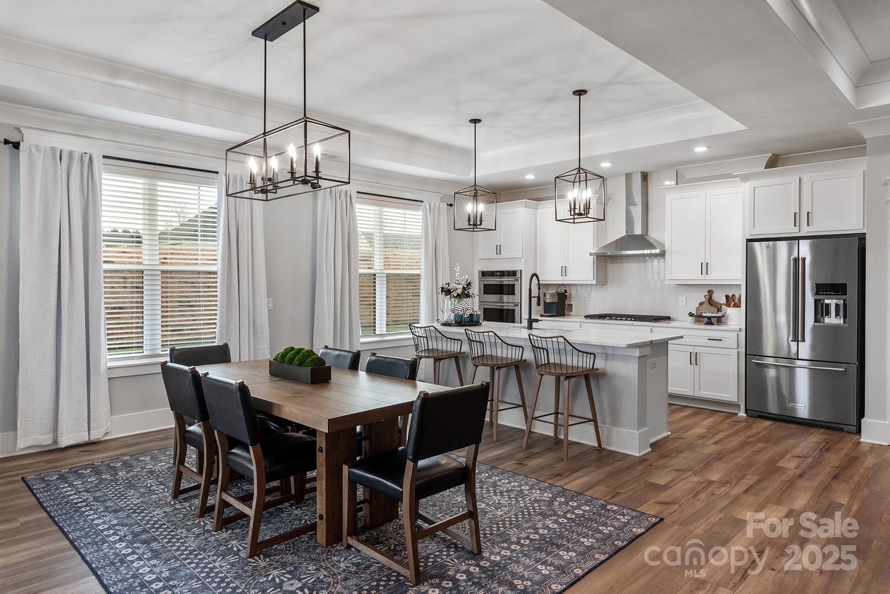 1945 Hendricks Street Rock Hill, SC 29732 - Photo 2 of 19 a kitchen with a dining table chairs stainless steel appliances and cabinets