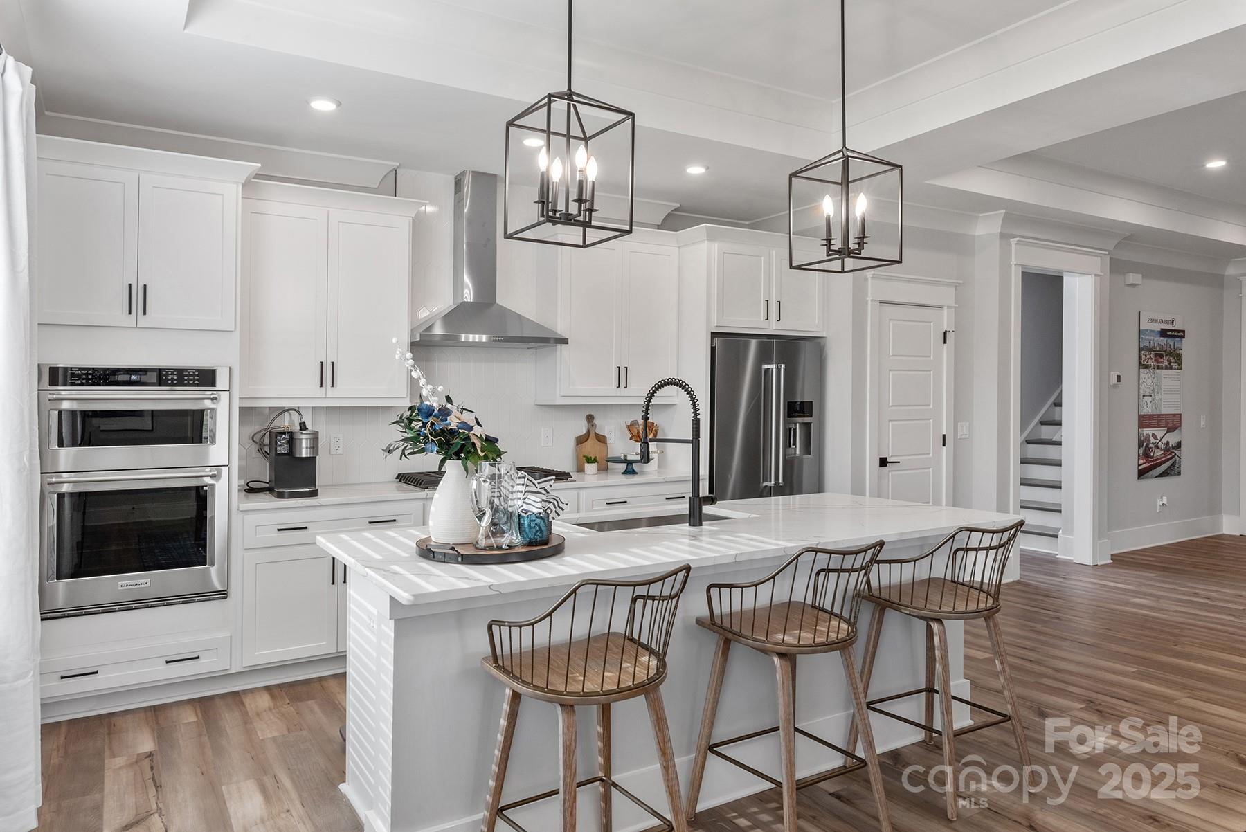 1945 Hendricks Street Rock Hill, SC 29732 - Photo 8 of 19 a kitchen with stainless steel appliances a dining table chairs and stove